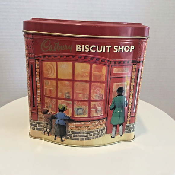 Cadbury Chocolate Biscuit Collector’s Tin Peering in a shop - Picture 1 of 6